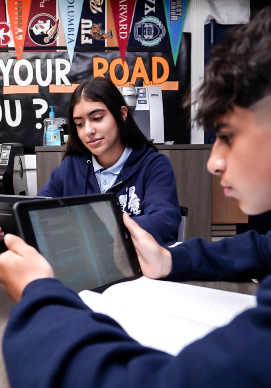 Edison students working together on an iPad
